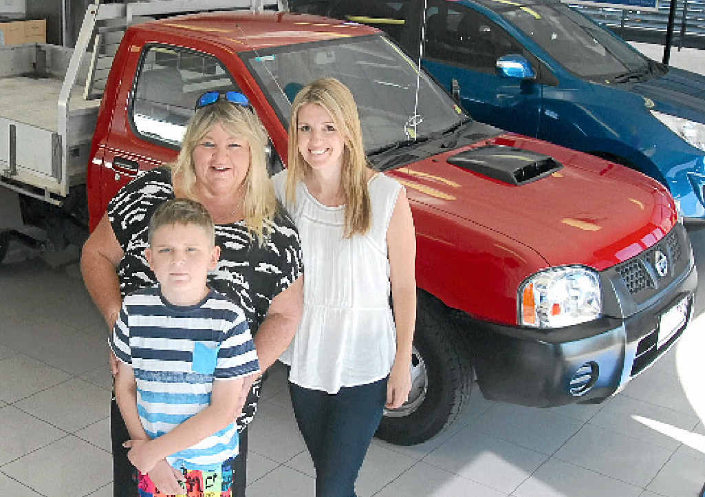 THRILLED: Kybie Hutton, 10, who is now in remission, and his mum, Kerry Lumsden, who also suffers from cancer, are pictured with Jaime Thurston from the charity http://www.52-lives.org. THRILLED: Kybie Hutton, 10, who is now in remission, and his mum, Kerry Lumsden, who also suffers from cancer, are pictured with Jaime Thurston from the charity http://www.52-lives.org.